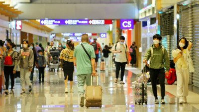台灣增逾2.1萬宗確診　下周一起旅客入境無需持核酸報告