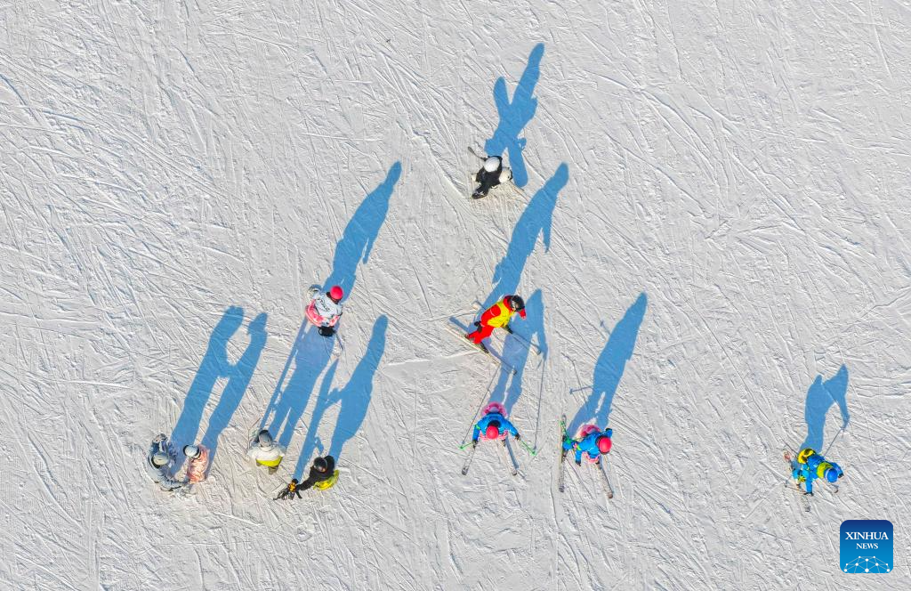 This aerial drone photo taken on Dec. 28, 2025 shows people skiing at a ski resort in Yutian County of north China's Hebei Province. (Photo by Liu Mancang/Xinhua)