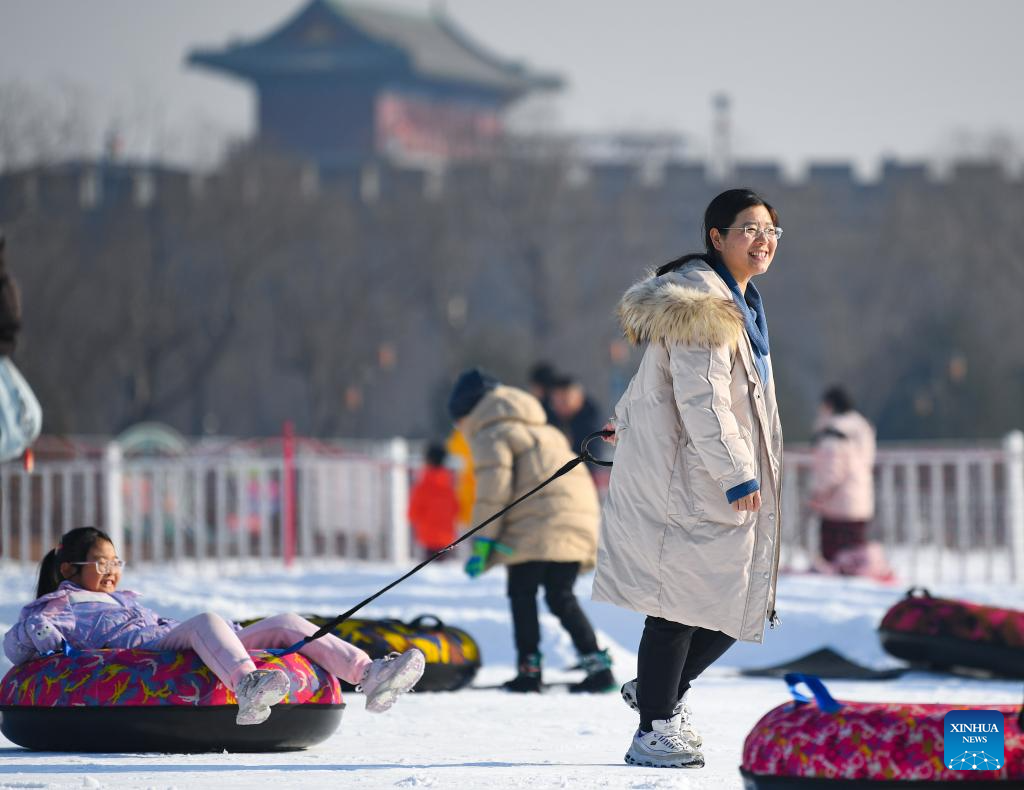 People play in an ice-and-snow theme park in Zhengding County of north China's Hebei Province, Dec. 28, 2025. (Photo by Zhang Xiaofeng/Xinhua)