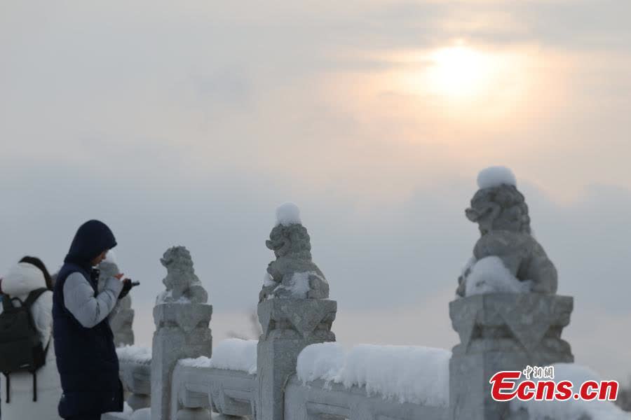 An aerial view taken on Jan. 17, 2026 shows snow-covered scenery at the Forbidden City in Beijing. (Photo/VCG)