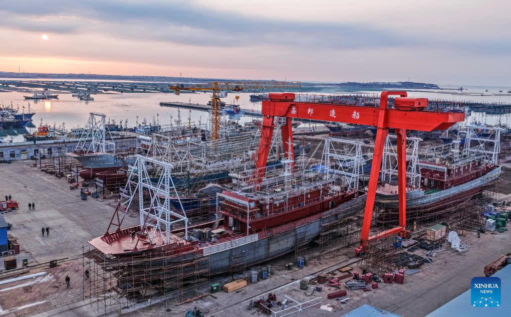 A drone photo taken on Jan. 28, 2026 shows a vessel under maintenance at an offshore engineering equipment industrial base in Rongcheng City of east China's Shandong Province. Enterprises across the country are going full steam ahead in production at the end of January, striving for a strong start in the first month of a new year. (Photo by Li Xinjun/Xinhua)