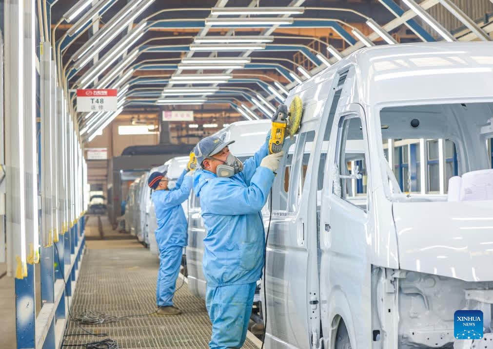 Workers are seen on a production line of an auto company in Jiangdu District of Yangzhou, east China's Jiangsu Province, Jan. 29, 2026. Enterprises across the country are going full steam ahead in production at the end of January, striving for a strong start in the first month of a new year. (Photo by Ren Fei/Xinhua)