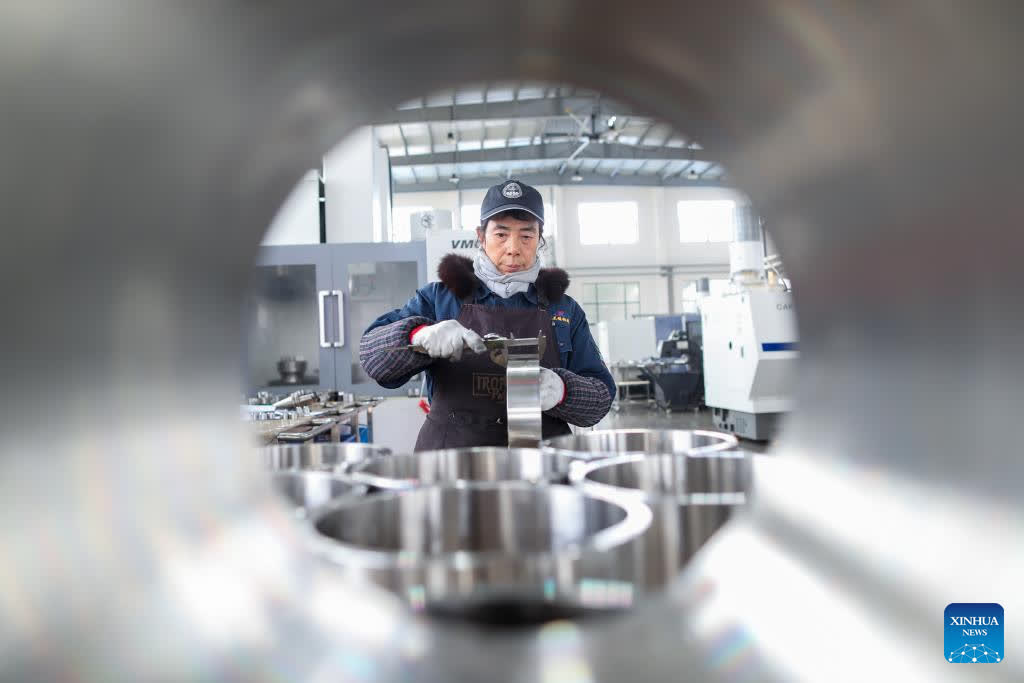 A worker checks products at a stainless steel company in Dainan Town of Xinghua City, east China's Jiangsu Province, Jan. 29, 2026. Enterprises across the country are going full steam ahead in production at the end of January, striving for a strong start in the first month of a new year. (Photo by Zhou Shegen/Xinhua)