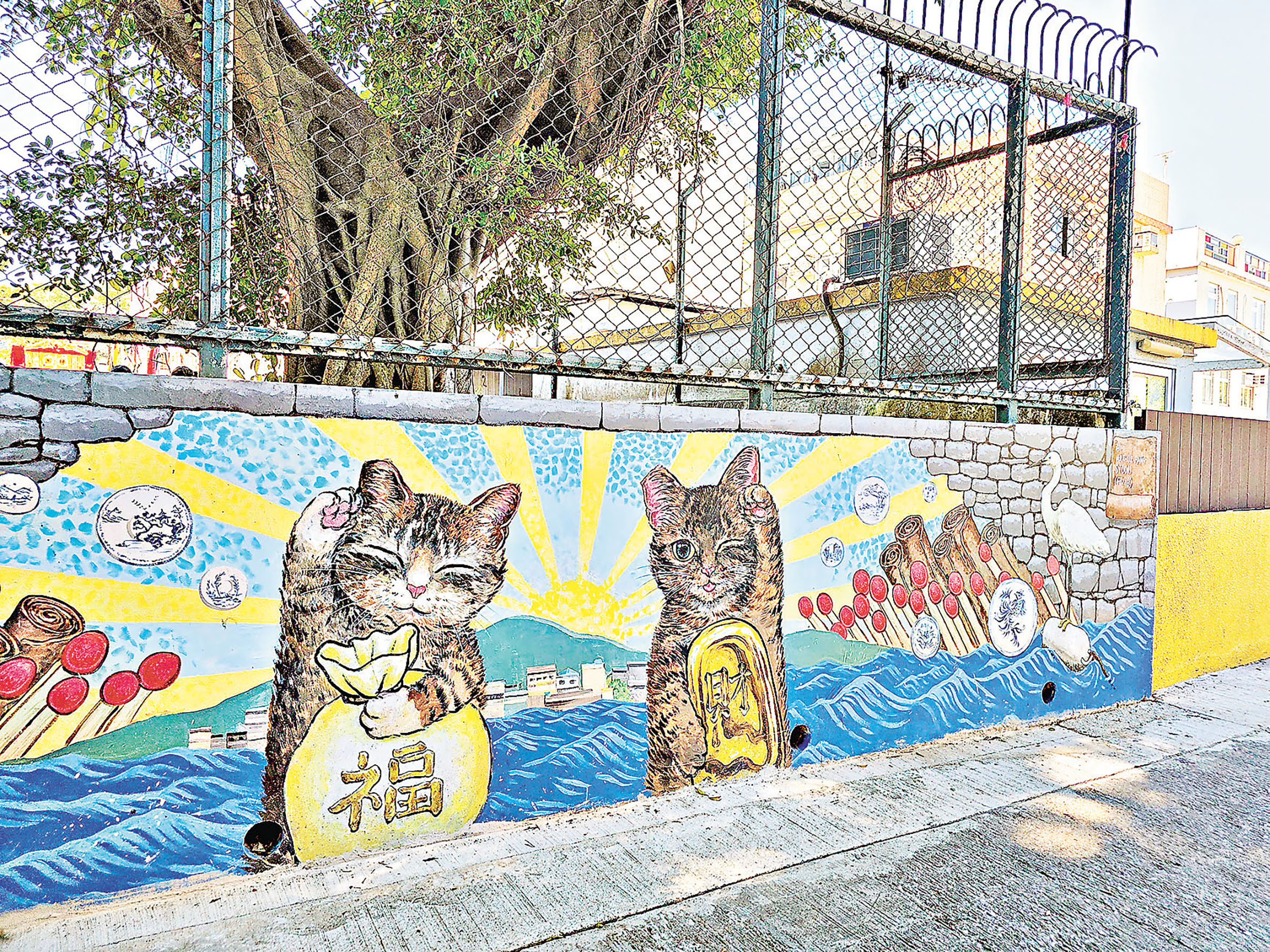 ■招財貓壁畫是打卡熱點。