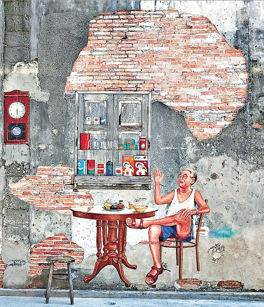 ■宋卡古城老街的當地居民生活彩繪牆畫。