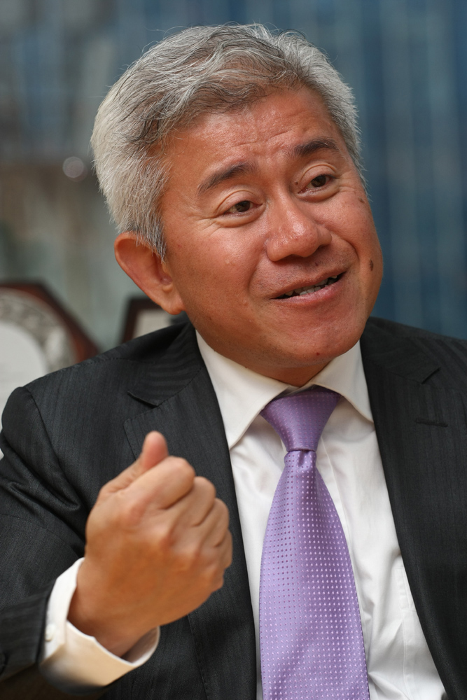 　　圖：經常笑容滿面的禤國全認為，做人一定要豁達，懂得與人分享是他的成功之道（林雨燊攝）