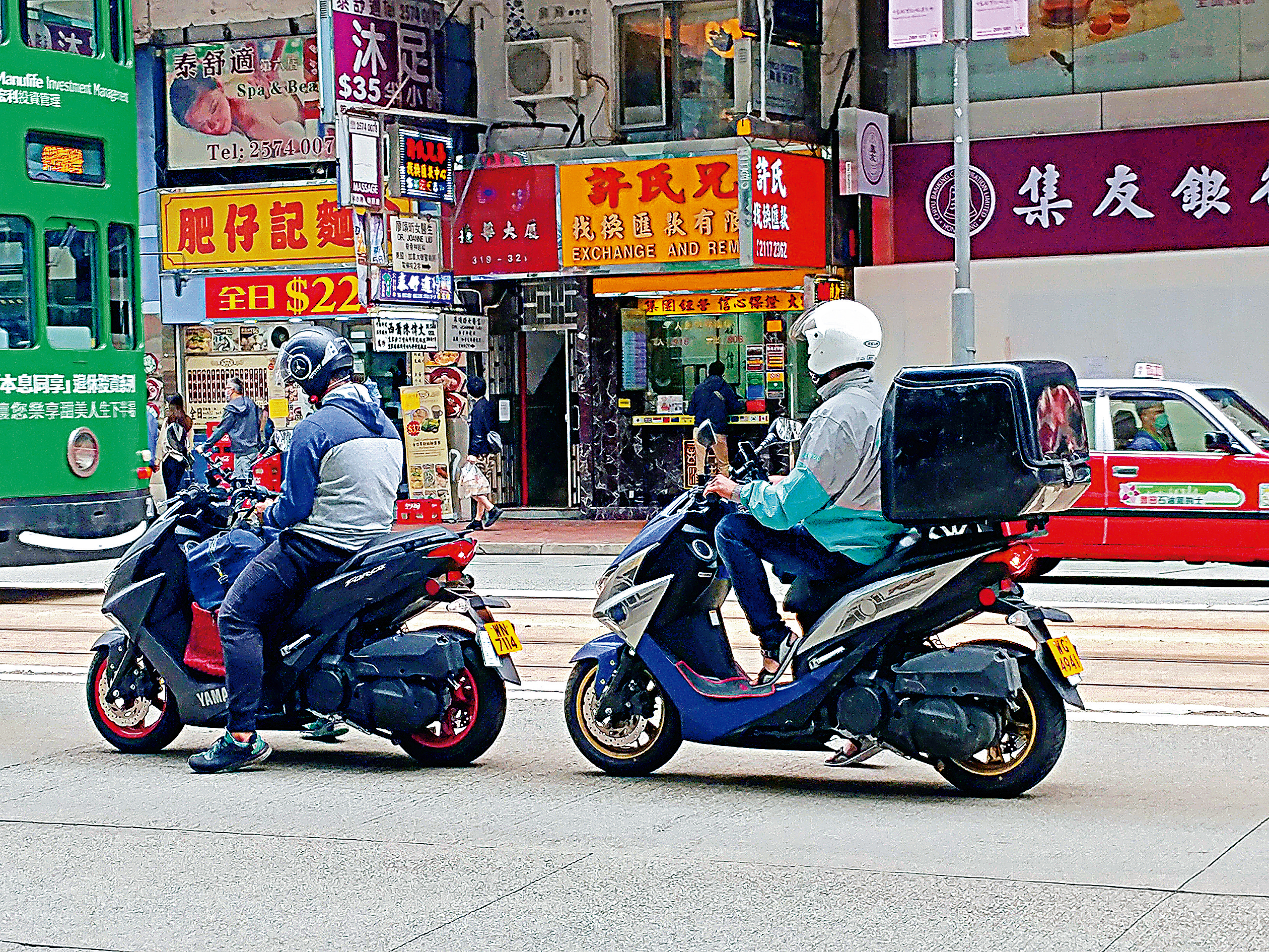 　　圖：跨區送餐一般要靠電單車手送外賣，午飯時段經常會見到他們的蹤影