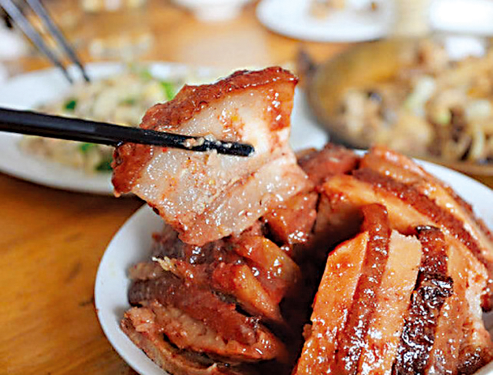 　　圖：皮脆肉嫩的虎皮扣肉是經典賀年菜。\網絡圖片