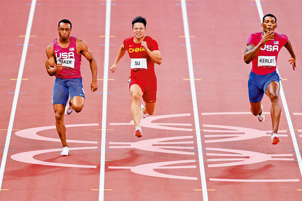 　　圖：蘇炳添（中）將領銜中國隊參加田徑世錦賽。\資料圖片