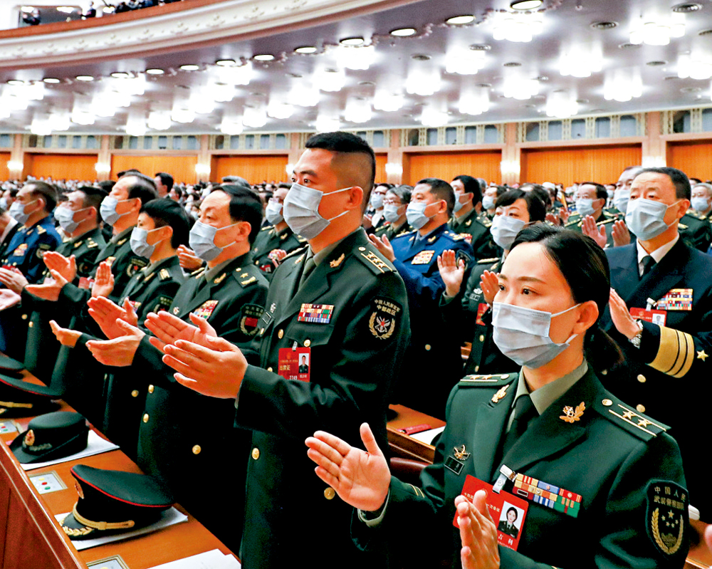 　　圖：3月10日，十四屆全國人大一次會議在北京人民大會堂舉行第三次全體會議。\新華社