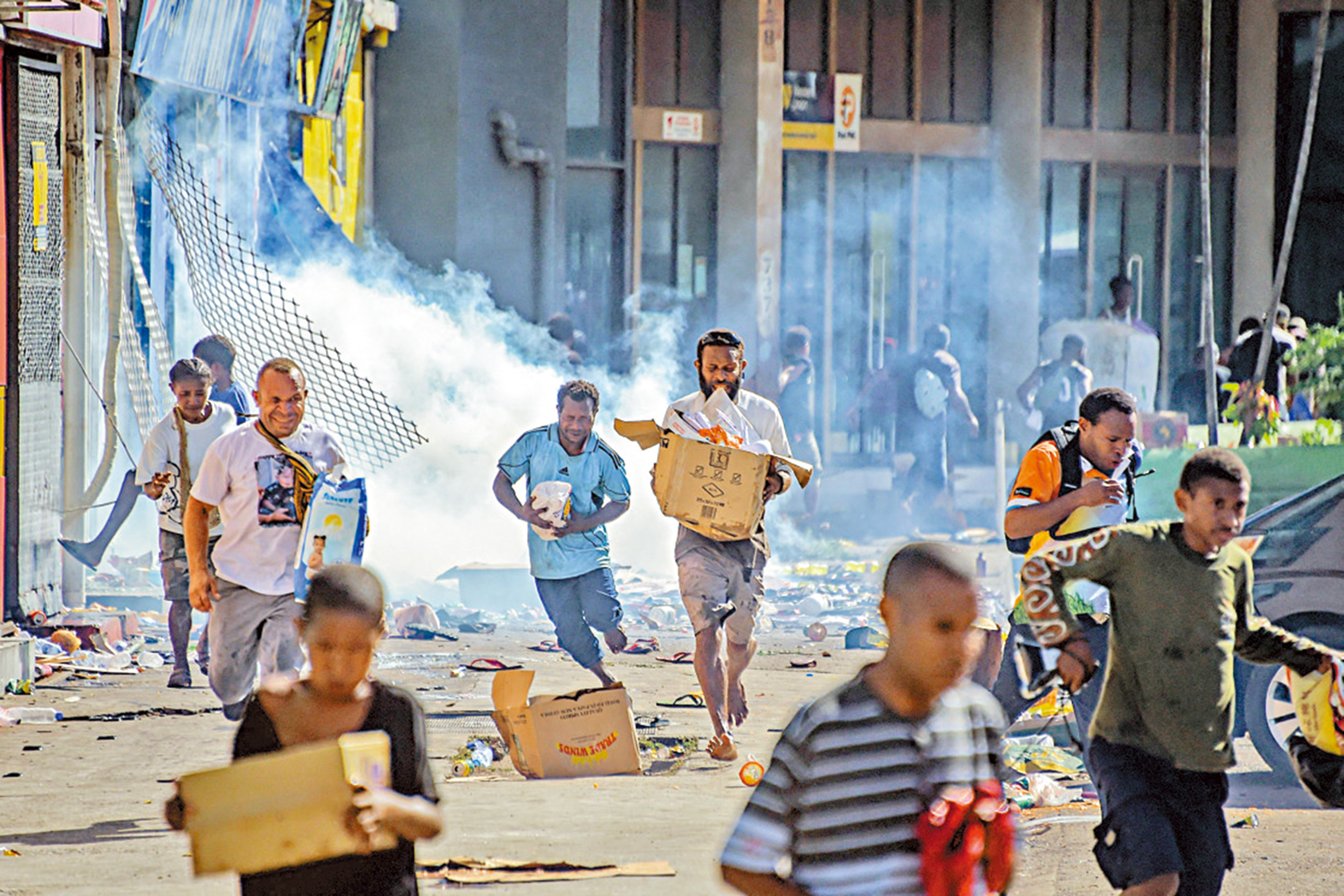 　　圖：巴布亞新幾內亞10日發生騷亂，多地商舖遭搶。\法新社