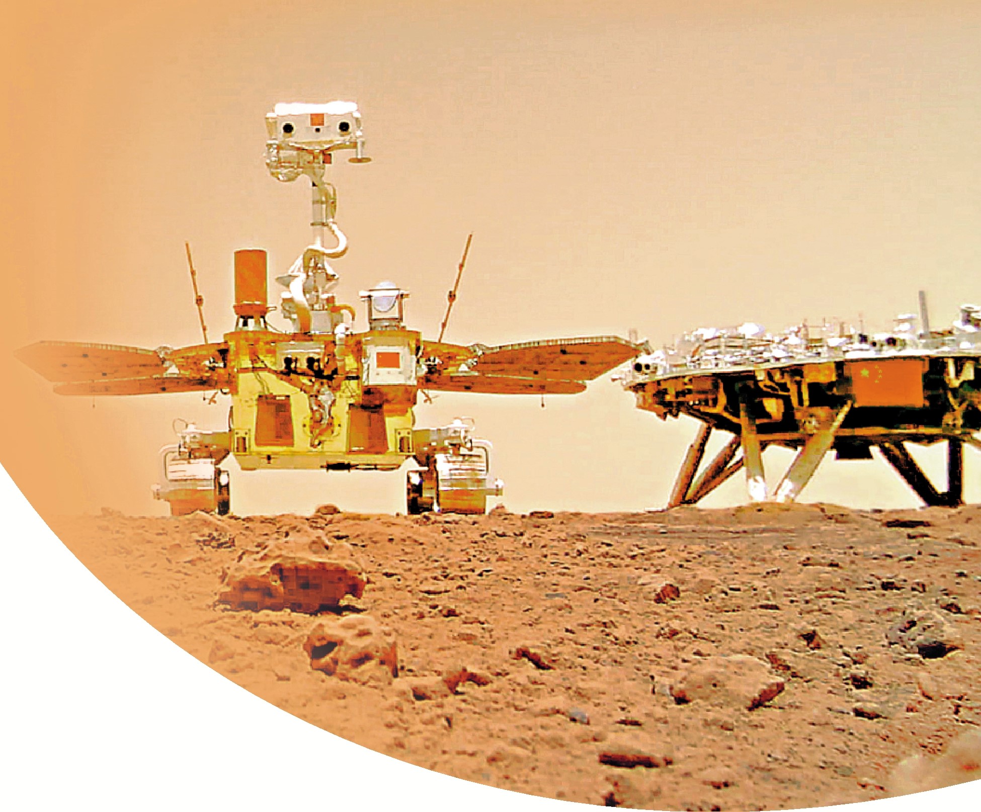 　　圖：2021年6月11日，天問一號着陸火星首批科學影像圖公布，我國首次火星探測任務取得圓滿成功。右為着陸平台，左為祝融號火星車。\新華社