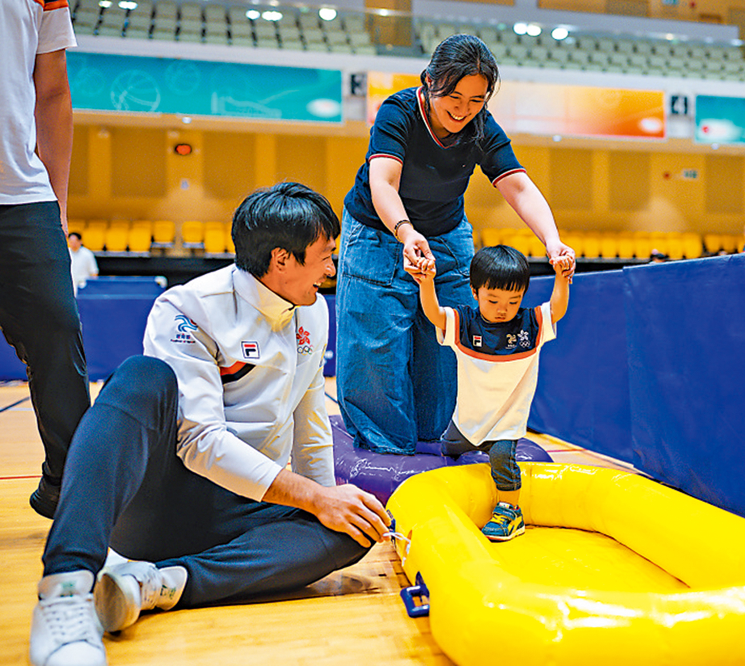 　　圖：姚錦成攜愛兒參與體育節