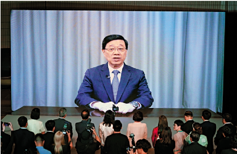 圖:香港特區行政長官李家超在開幕禮上視頻致辭。