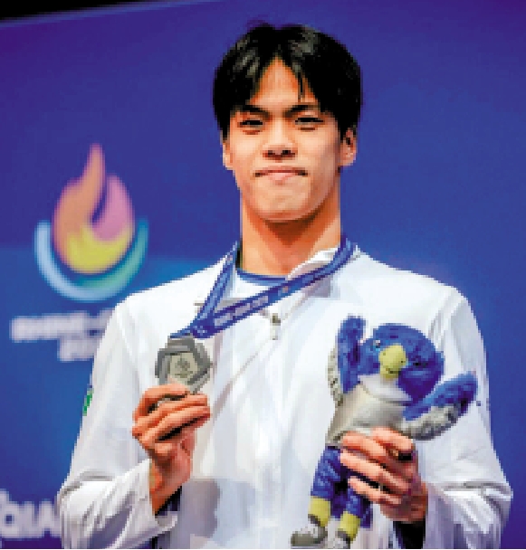 　　圖：麥世霆是首位登上大運會頒獎台的港隊男子泳手。\大運會官網圖片