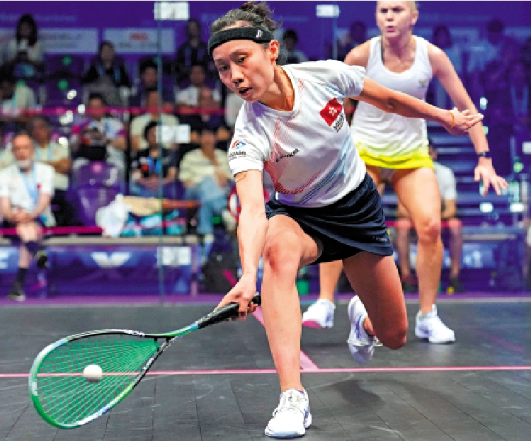 　　圖：中國香港選手何子樂（左）在比賽中回球。\新華社