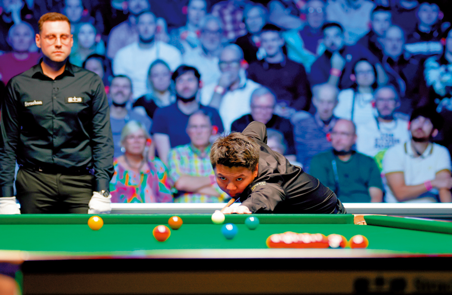 　　圖：周躍龍（右）在比賽中。