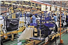 　　圖：台美關稅協議細節不明朗，台業界提心吊膽。圖為台灣汽車廠房。/資料圖片