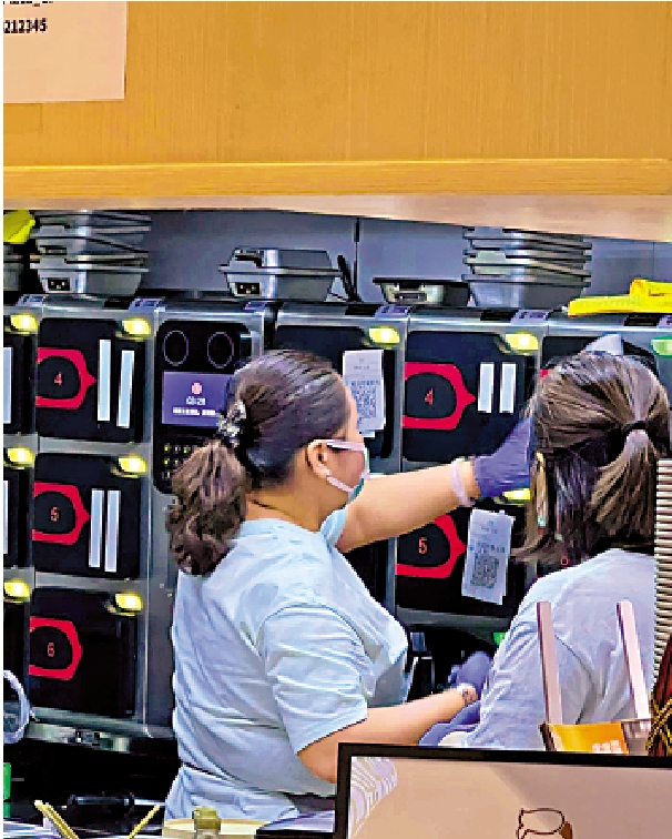 　　圖：有餐廳引入炒菜機，東主表示成本比聘請廚師更低。