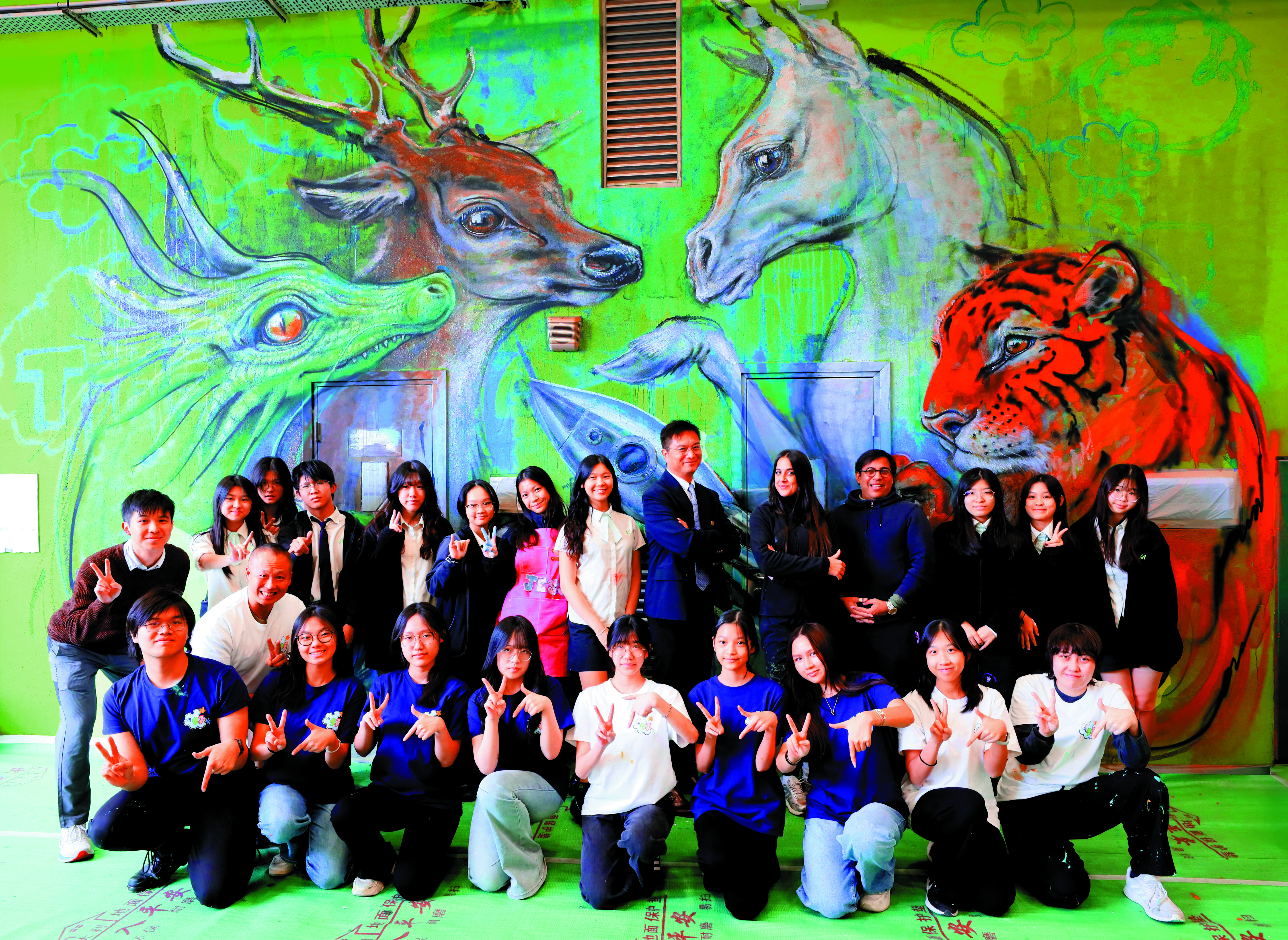 　　圖：「藝術家駐校計劃」邀請了德國壁畫家Hera Herakut帶領學生一同創作多幅巨型壁畫。