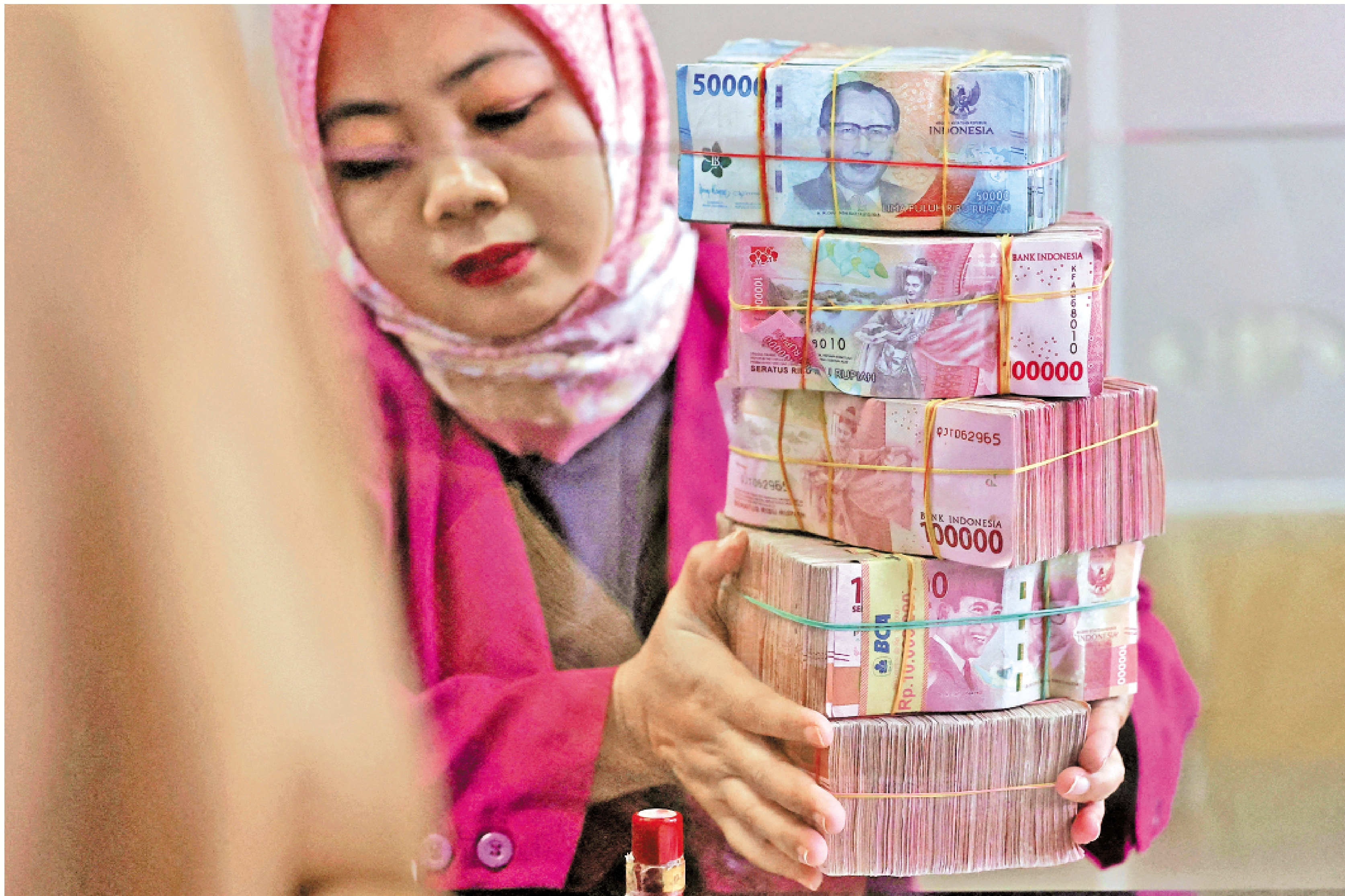 　　圖：印尼盾今年來已貶值近一成，為亞洲最弱貨幣。\路透社