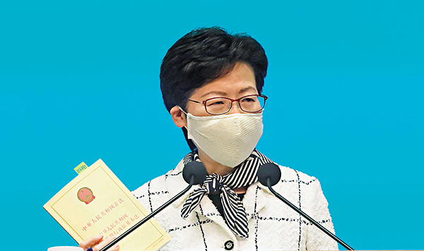 ■林鄭月娥在行會前見記者,強調香港沒有「三權分立」。 香港文匯報記者 攝