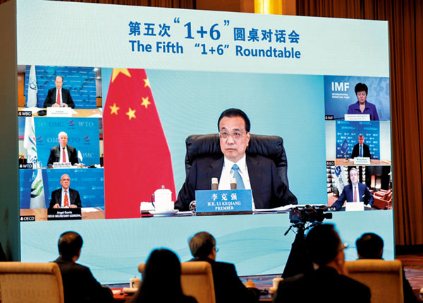 ■李克強24日晚在北京同世界銀行行長馬爾帕斯、國際貨幣基金組織總裁格奧爾基耶娃、世界貿易組織副總幹事沃爾夫、國際勞工組織總幹事萊德、經濟合作與發展組織秘書長古里亞和金融穩定理事會主席誇爾斯舉行第五次「1+6」圓桌對話會。 網上圖片