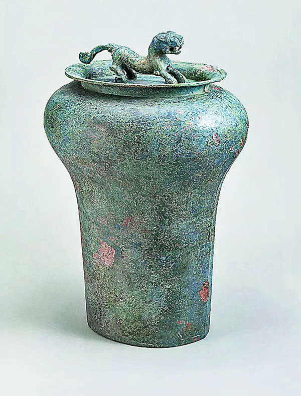 ●戰國青銅虎鈕錞于