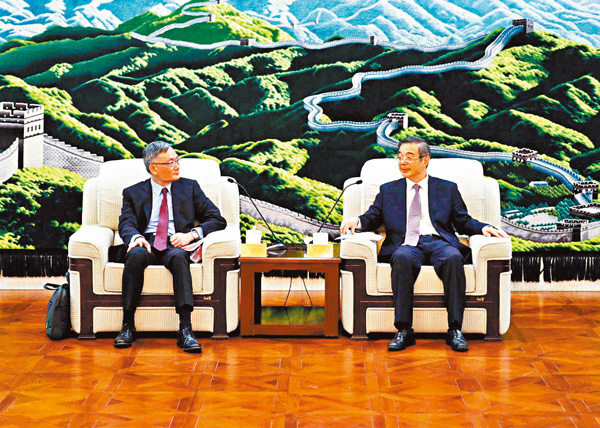 ●周強(右)會見張舉能(左)。 資料圖片