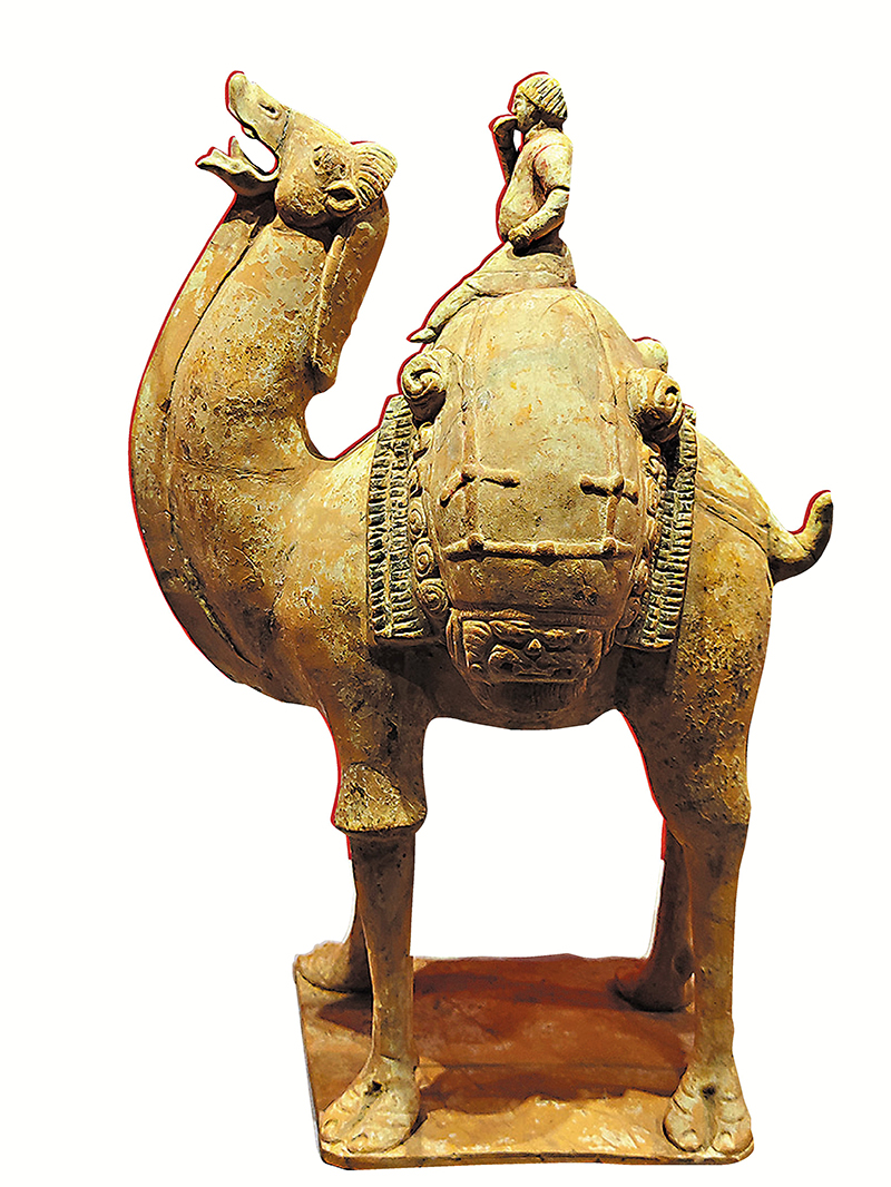◆胡人吃餅騎駝俑，隋代，山西博物院藏。