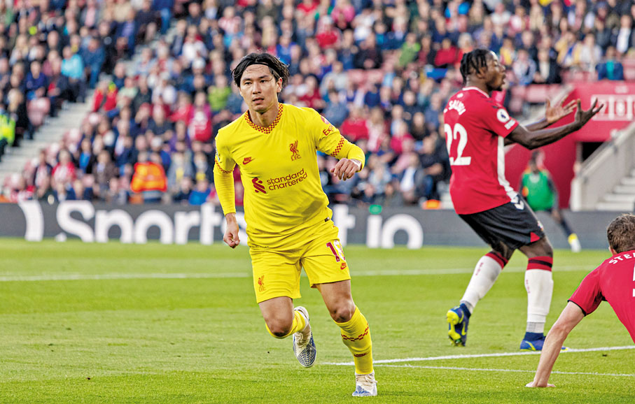 ◆南野拓實慶祝入球。 新華社