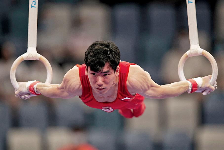 ◆ 張博恒在吊環比賽中。 新華社