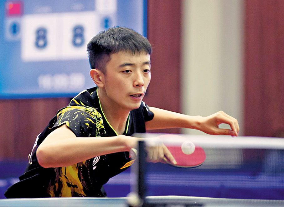 ◆ 陳垣宇在U19男子單打決賽中回球。 新華社