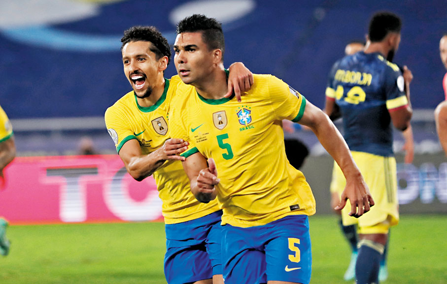 ◆卡斯米路(右)和馬昆奴斯，組成了巴西隊的中場和後防中軸線。  美聯社