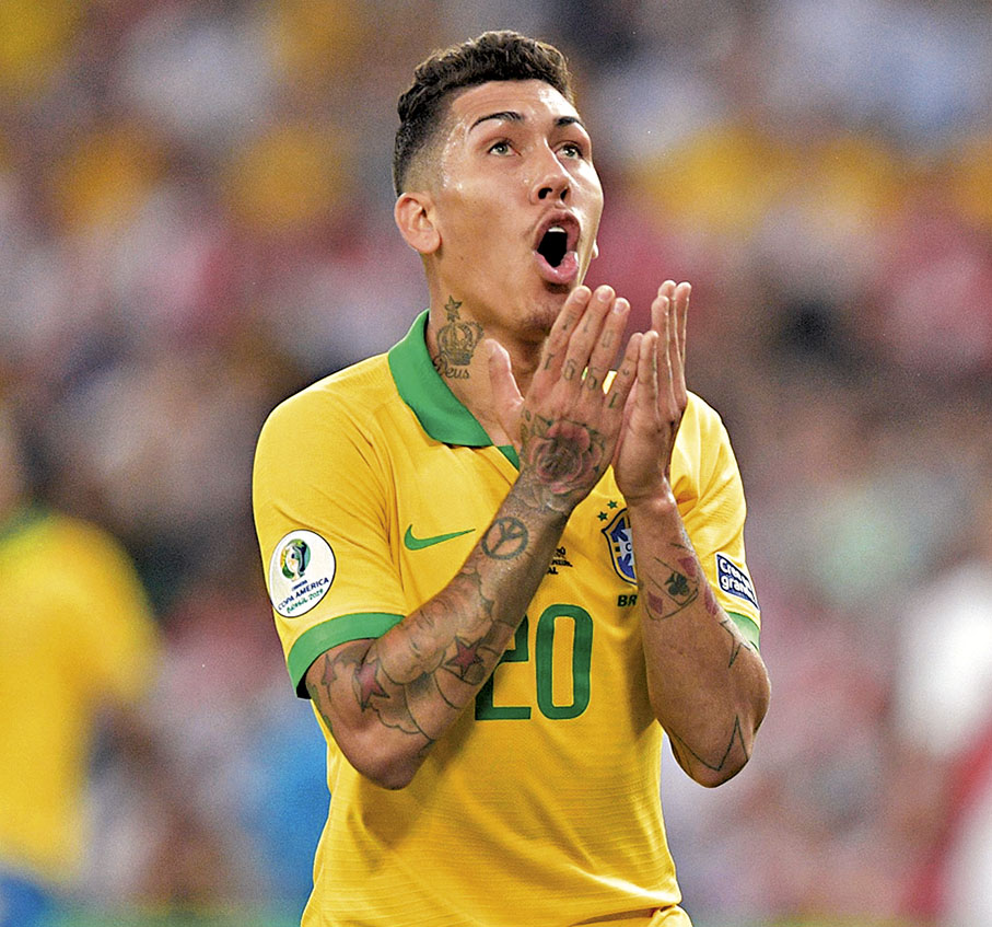 ◆ 本賽季狀態回勇的利物浦射手法明奴意外落選。  法新社