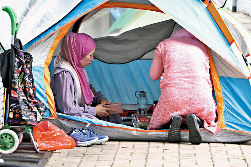 ◆外傭在帳篷內度假。 香港文匯報記者北山彥 攝
