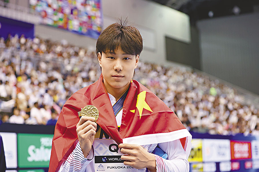 ◆覃海洋指自己獲選任旗手是中國游泳隊的榮譽。  資料圖片