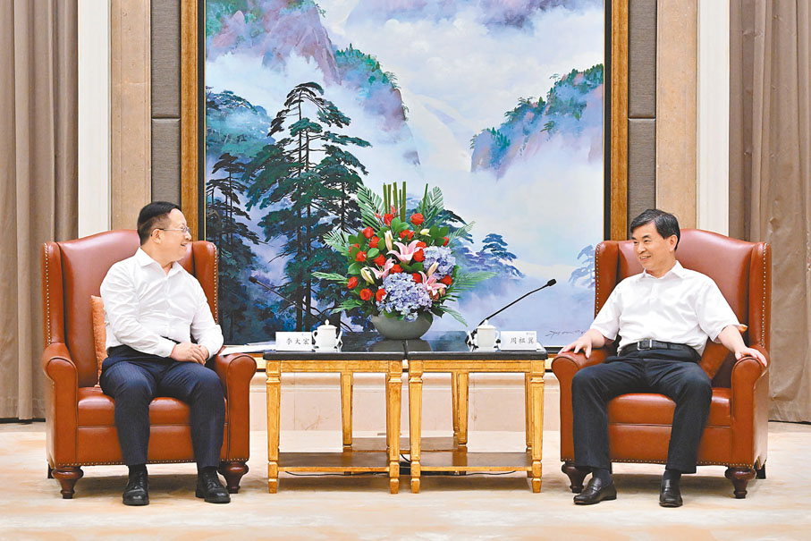 ◆周祖翼（右）會見李大宏（左）。