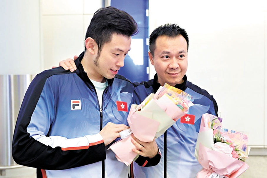 ●總教練李靜（右）與黃鎮廷。 中國香港乒乓總會圖片