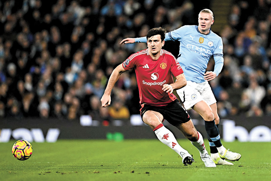 ●曼城王牌艾寧夏蘭特（右）被今場擔正的後防大將哈利馬古尼凍結。  法新社