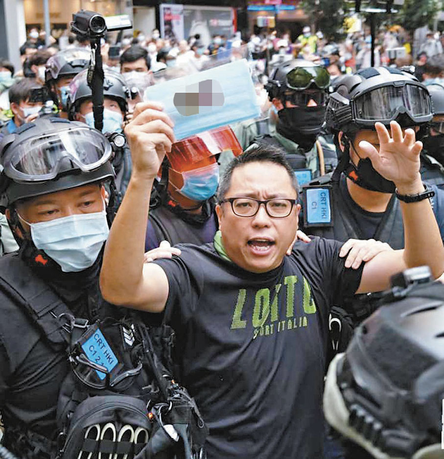 ●譚得志煽動案同收錄在更新版的《案例摘要》內。圖為譚得志被警方拘捕。 資料圖片