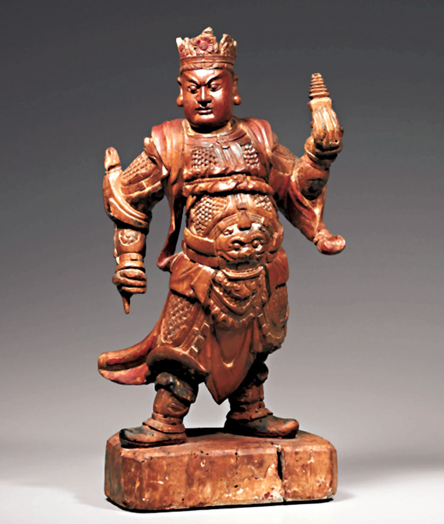 ●圖為明代木雕「毗沙門天王」像。 網上圖片