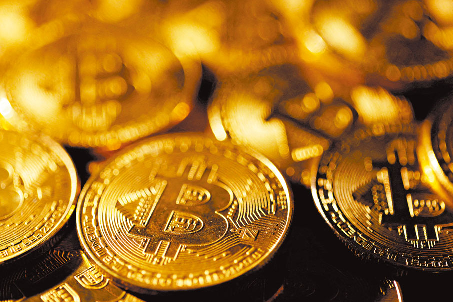 ●比特幣等加密貨幣價格可一天內暴漲暴跌,AI可助投資者作動態風控。 資料圖片