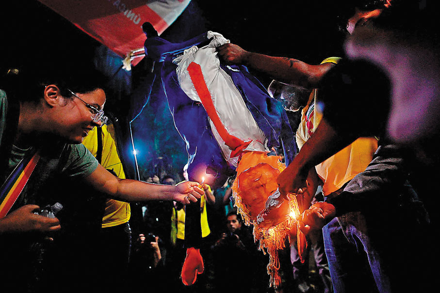 ●巴西出口美國的多數商品實際稅率高達50%，憤怒的民眾在反美示威中火燒特朗普肖像。 法新社