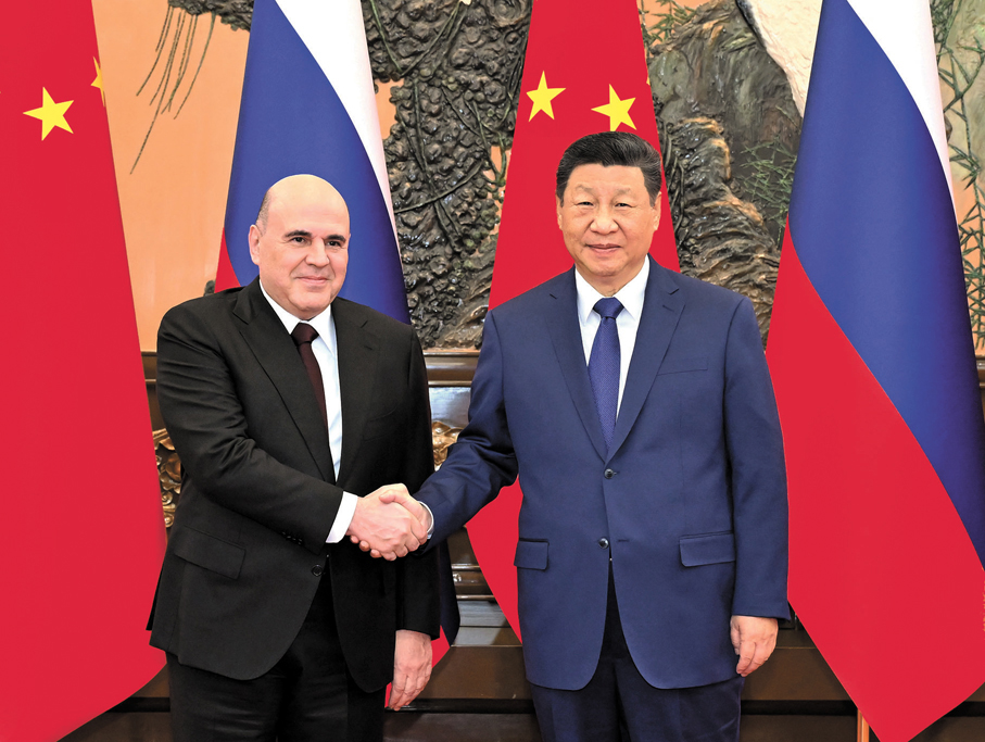 ●4日上午，國家主席習近平在北京人民大會堂會見俄羅斯總理米舒斯京。     新華社