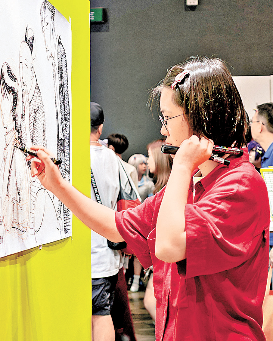 ●燒在香港動漫電玩節現場作畫。 馮翠怡  攝