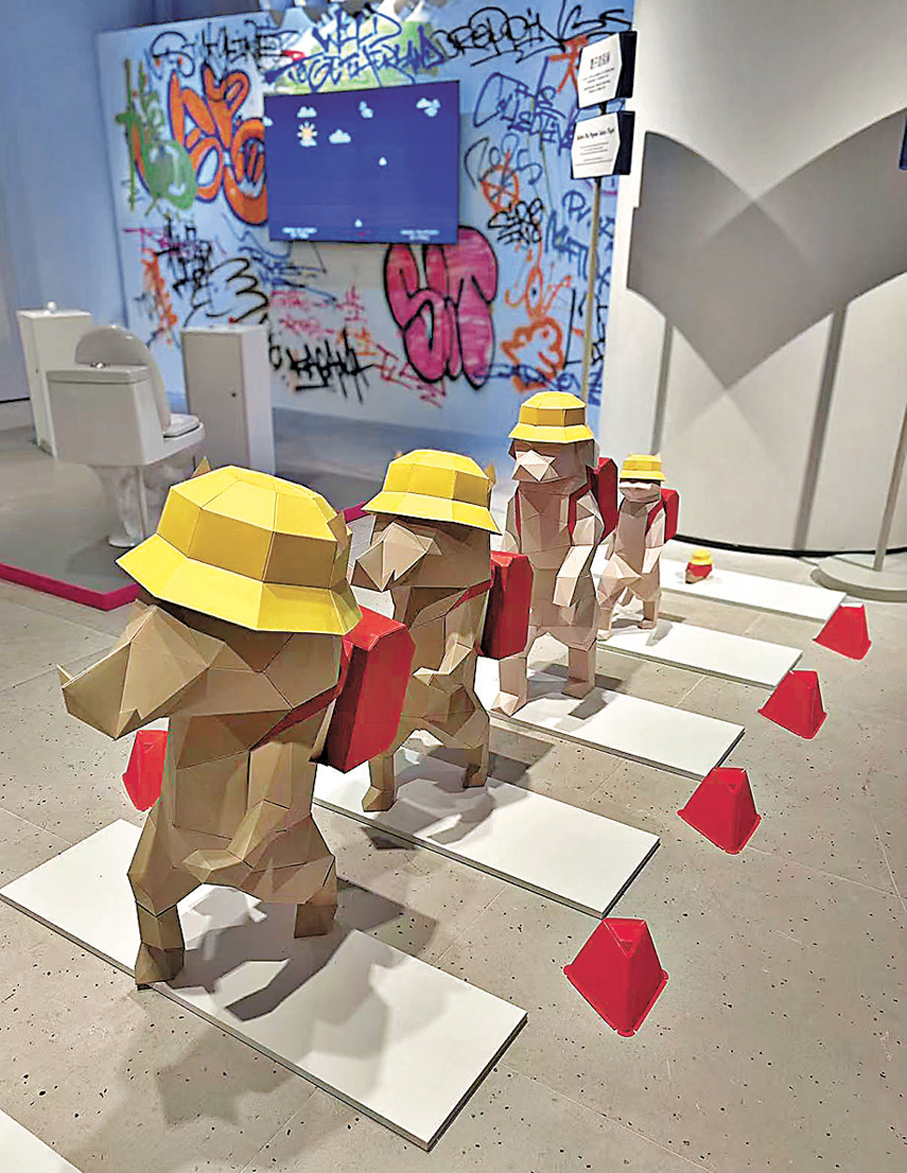 ●《城市動物寓言》以香港人熟悉的「野豬」為主角，呈現多隻小豬過馬路的場景。