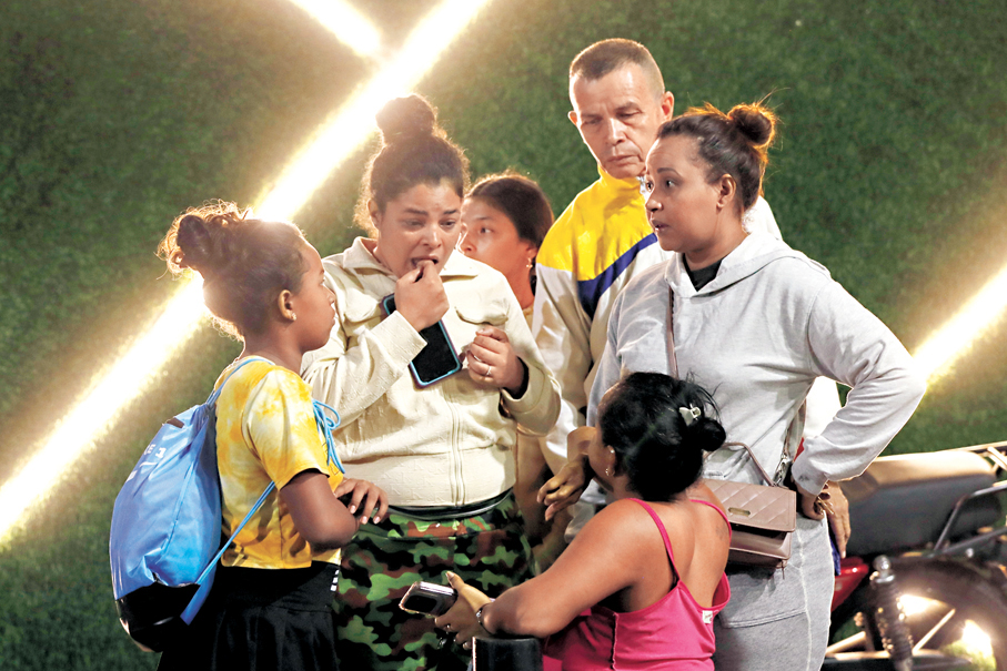 ●加拉加斯居民一臉愁容。 美聯社