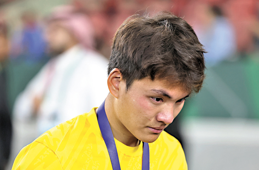 ●門將李昊賽後流下英雄淚。 新華社