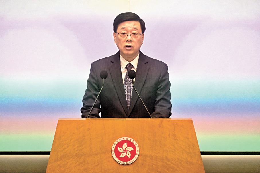 ●李家超昨日在行政會議前見記者。香港文匯報記者涂穴  攝